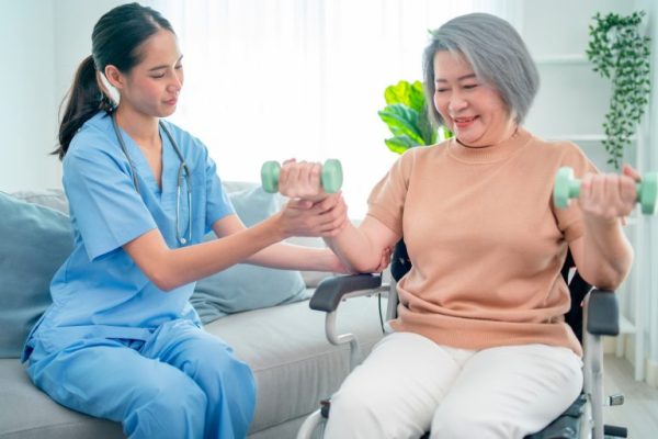 asian-nurse-or-doctor-who-work-as-homecare-support-staff-help-senior-woman-exercise-768x512